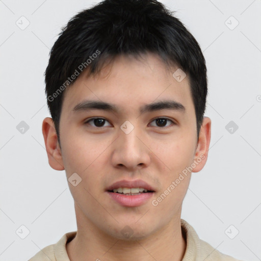 Joyful white young-adult male with short  black hair and brown eyes