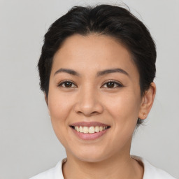 Joyful asian young-adult female with short  brown hair and brown eyes