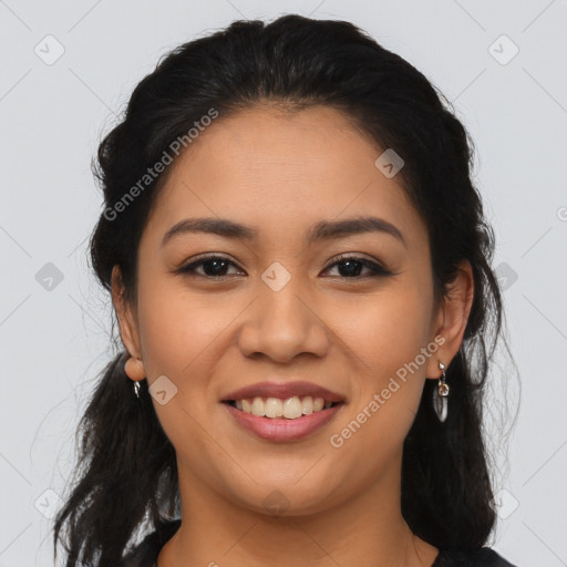 Joyful latino young-adult female with long  brown hair and brown eyes