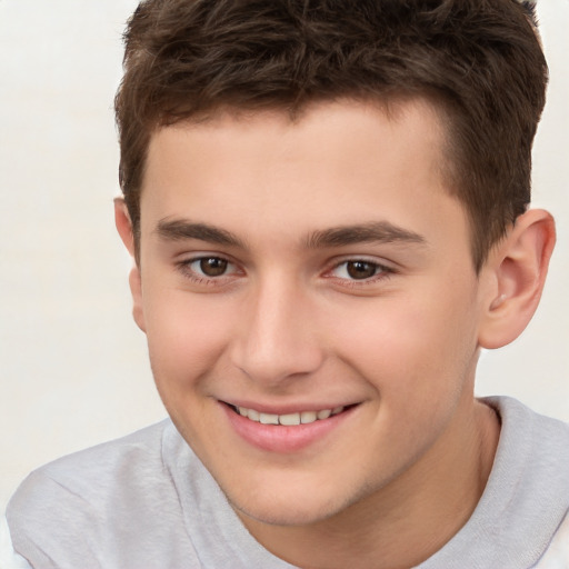 Joyful white child male with short  brown hair and brown eyes