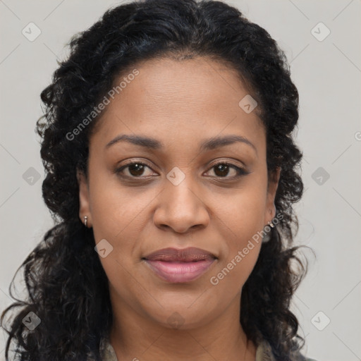 Joyful black young-adult female with long  brown hair and brown eyes