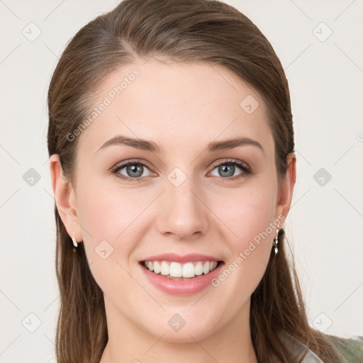 Joyful white young-adult female with long  brown hair and grey eyes