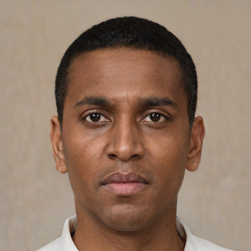 Neutral black young-adult male with short  black hair and brown eyes