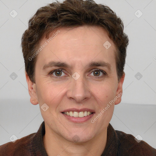 Joyful white adult male with short  brown hair and grey eyes