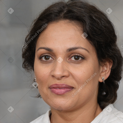 Joyful latino adult female with medium  brown hair and brown eyes