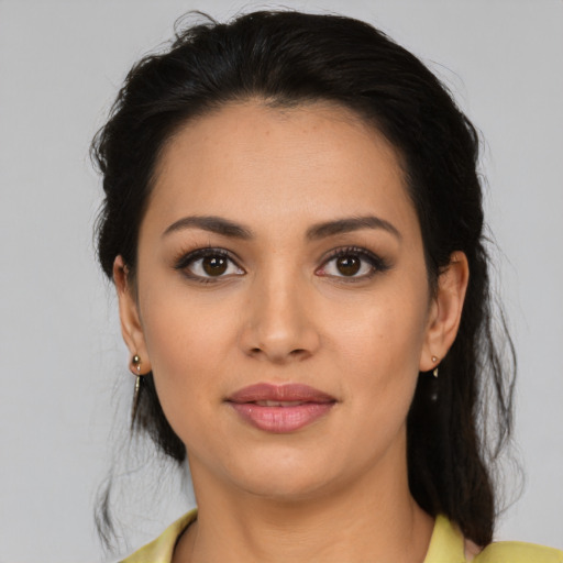 Joyful latino young-adult female with medium  black hair and brown eyes