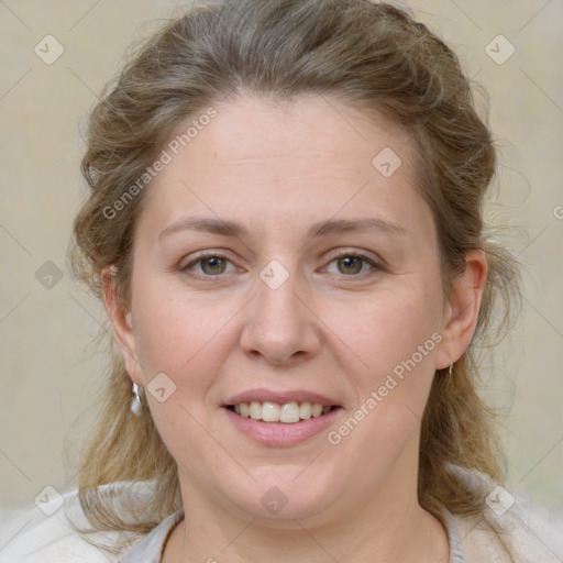 Joyful white young-adult female with medium  brown hair and blue eyes