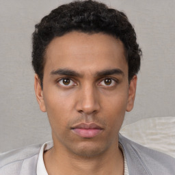Neutral white young-adult male with short  black hair and brown eyes