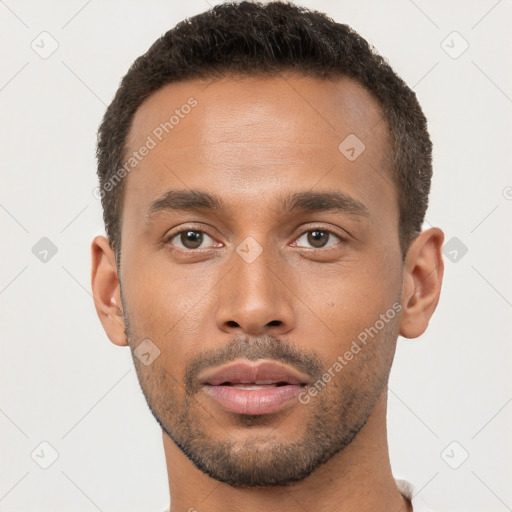 Neutral black young-adult male with short  brown hair and brown eyes