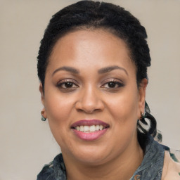 Joyful latino young-adult female with short  black hair and brown eyes