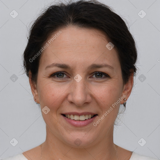 Joyful white adult female with short  brown hair and brown eyes