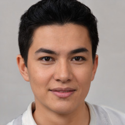 Joyful latino young-adult male with short  brown hair and brown eyes