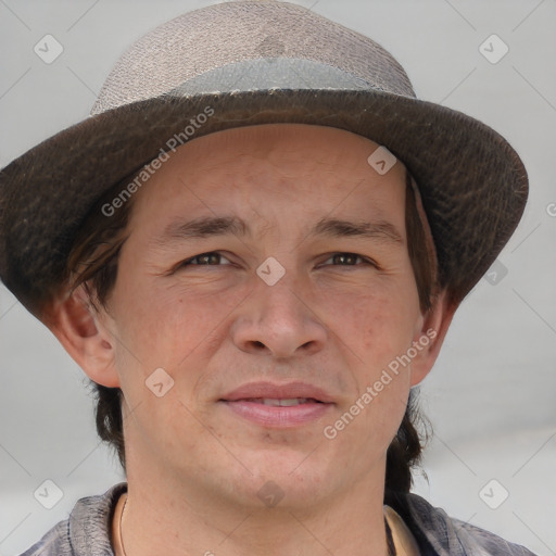 Joyful white adult male with short  brown hair and brown eyes