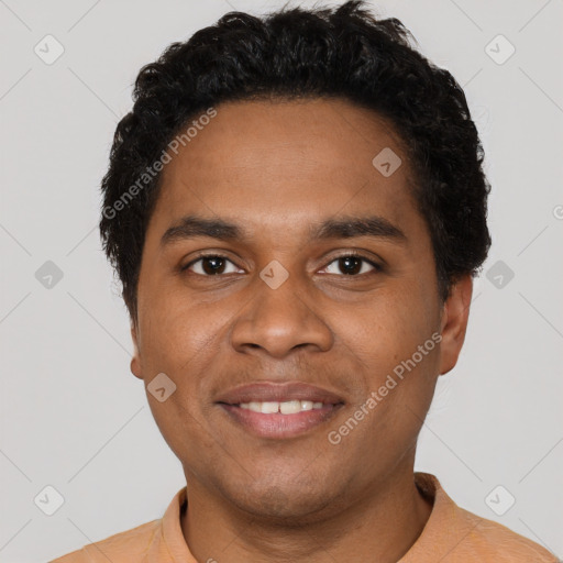 Joyful black young-adult male with short  black hair and brown eyes