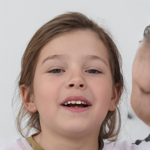 Joyful white child female with medium  brown hair and brown eyes