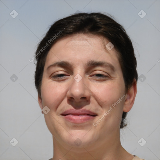 Joyful white adult female with short  brown hair and brown eyes