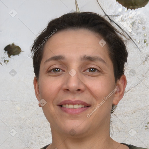 Joyful white adult female with short  brown hair and brown eyes