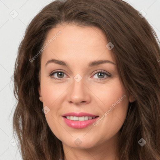 Joyful white young-adult female with long  brown hair and green eyes