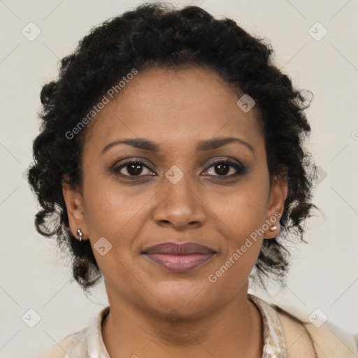 Joyful black adult female with short  brown hair and brown eyes