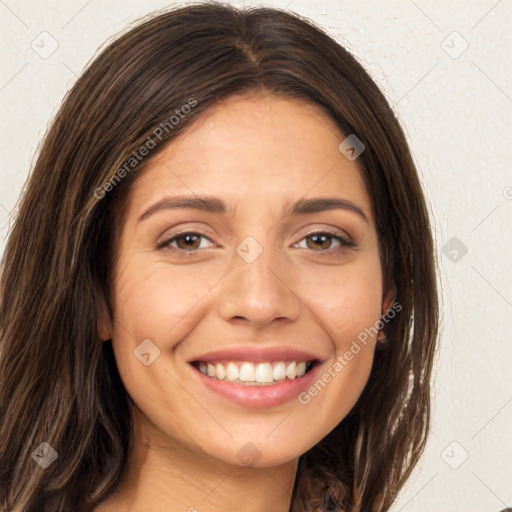 Joyful white young-adult female with long  brown hair and brown eyes