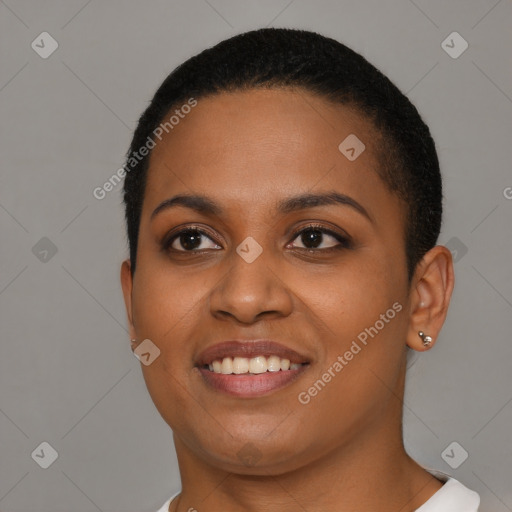 Joyful black young-adult female with short  black hair and brown eyes