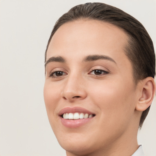 Joyful white young-adult female with short  brown hair and brown eyes