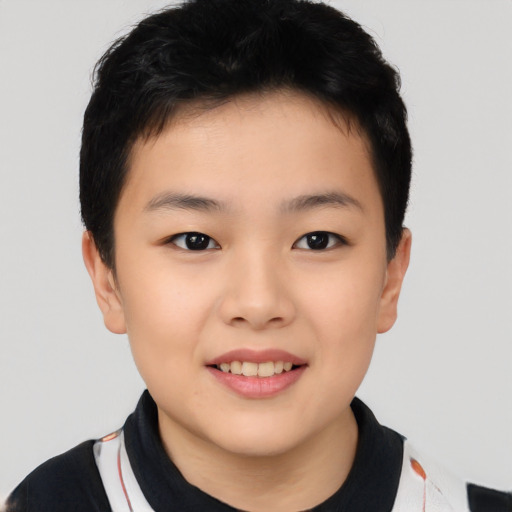 Joyful asian child female with short  brown hair and brown eyes