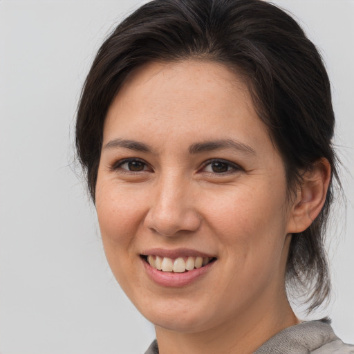 Joyful white young-adult female with medium  brown hair and brown eyes