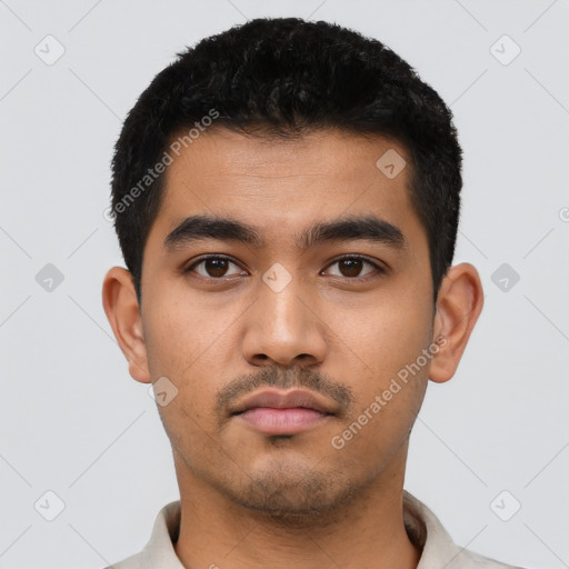 Neutral latino young-adult male with short  black hair and brown eyes
