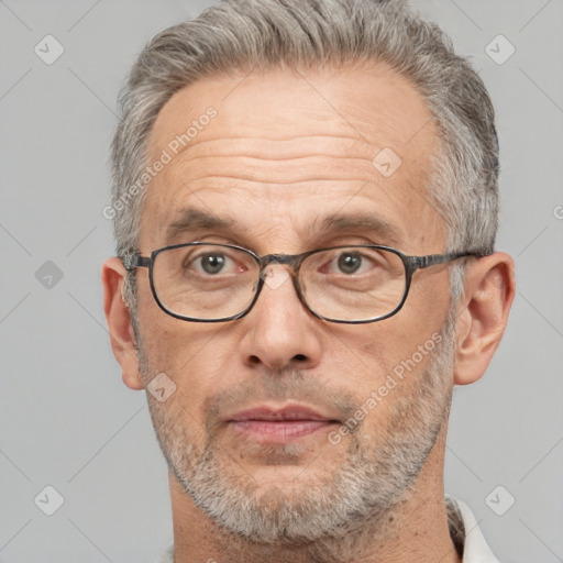 Neutral white middle-aged male with short  gray hair and brown eyes