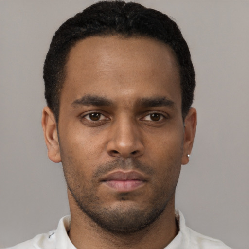 Neutral black young-adult male with short  black hair and brown eyes
