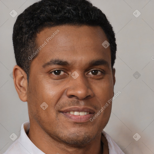 Joyful latino young-adult male with short  brown hair and brown eyes