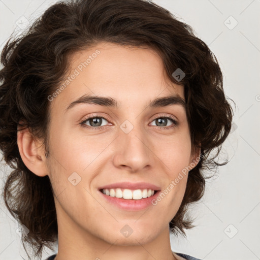 Joyful white young-adult female with medium  brown hair and green eyes