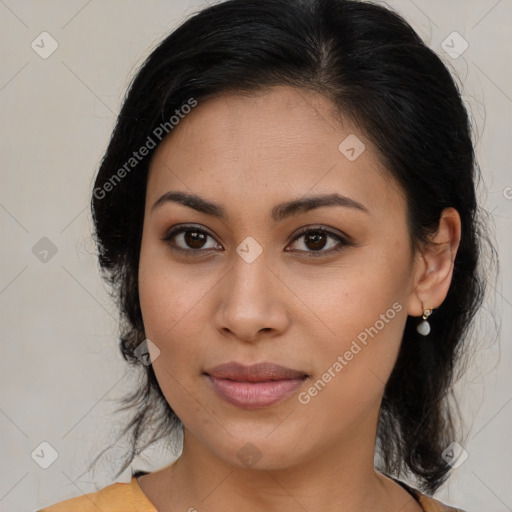 Joyful latino young-adult female with medium  brown hair and brown eyes