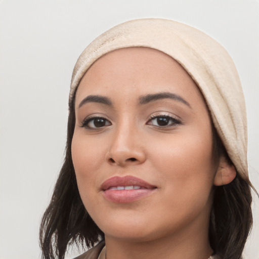 Joyful white young-adult female with long  black hair and brown eyes