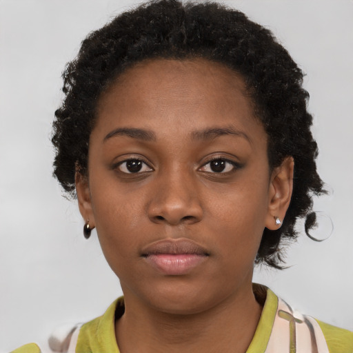 Neutral black young-adult female with short  brown hair and brown eyes