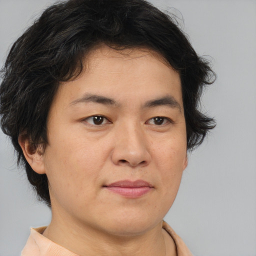 Joyful asian young-adult female with short  brown hair and brown eyes