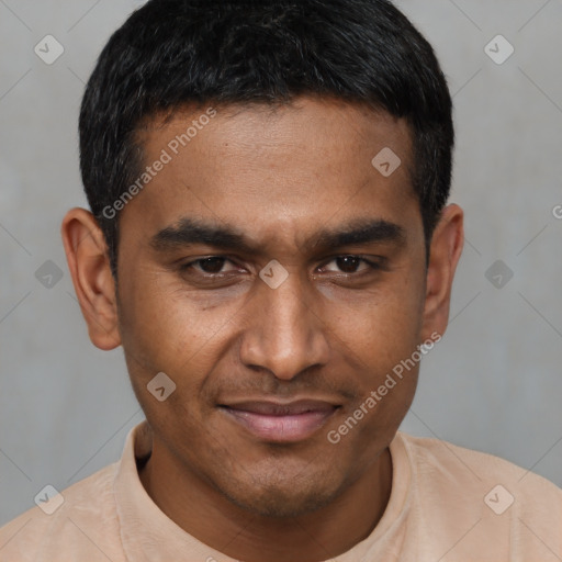 Joyful black young-adult male with short  black hair and brown eyes
