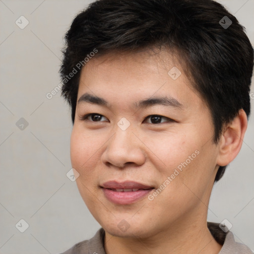 Joyful asian young-adult male with short  brown hair and brown eyes