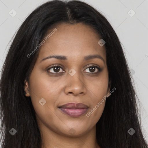 Joyful black young-adult female with long  brown hair and brown eyes