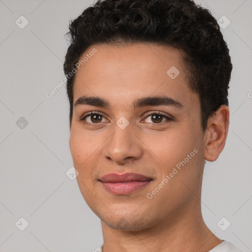 Joyful white young-adult male with short  black hair and brown eyes