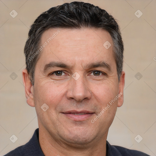 Joyful white adult male with short  brown hair and brown eyes