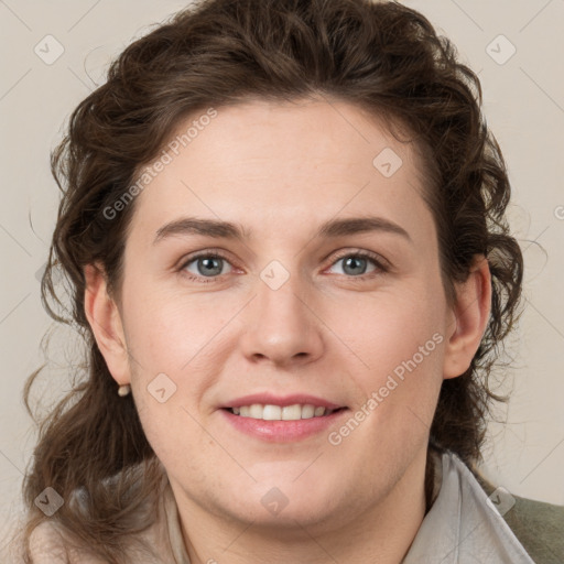 Joyful white young-adult female with medium  brown hair and green eyes