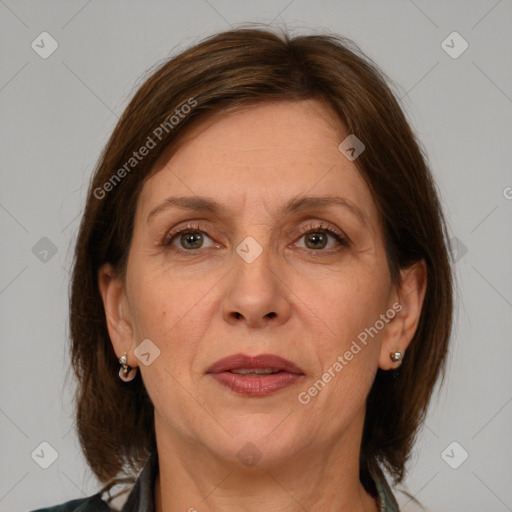 Joyful white adult female with medium  brown hair and grey eyes