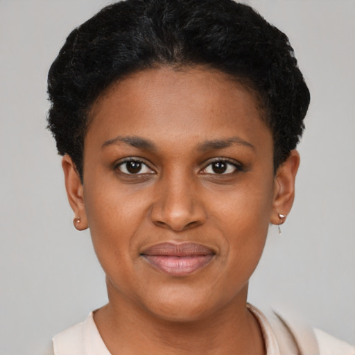 Joyful black young-adult female with short  brown hair and brown eyes