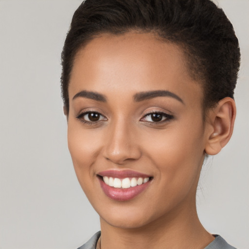 Joyful white young-adult female with short  brown hair and brown eyes