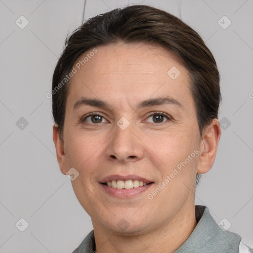 Joyful white adult female with short  brown hair and grey eyes