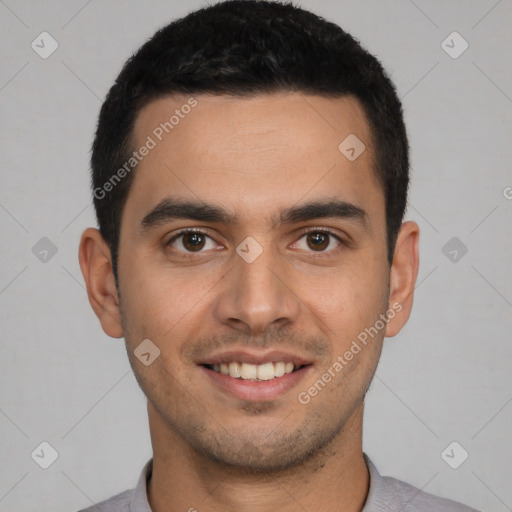 Joyful white young-adult male with short  black hair and brown eyes