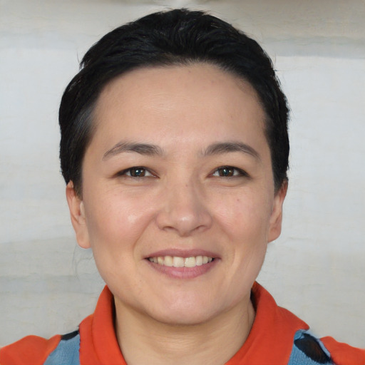 Joyful white young-adult female with short  black hair and brown eyes