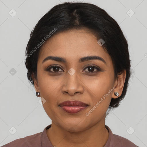 Joyful latino young-adult female with medium  black hair and brown eyes